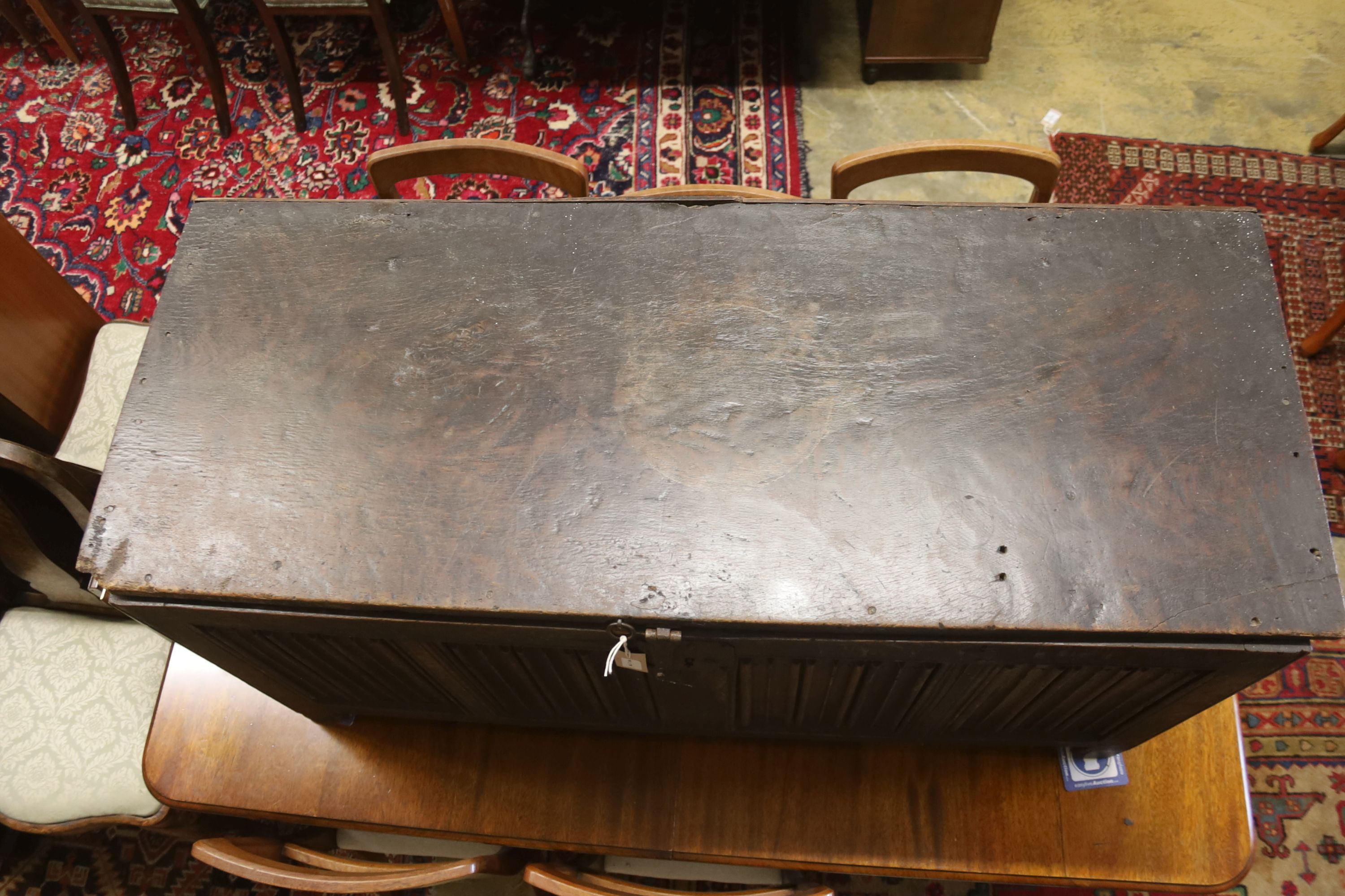 A carved and panelled oak chest, length 129cm, depth 51cm, height 63cm